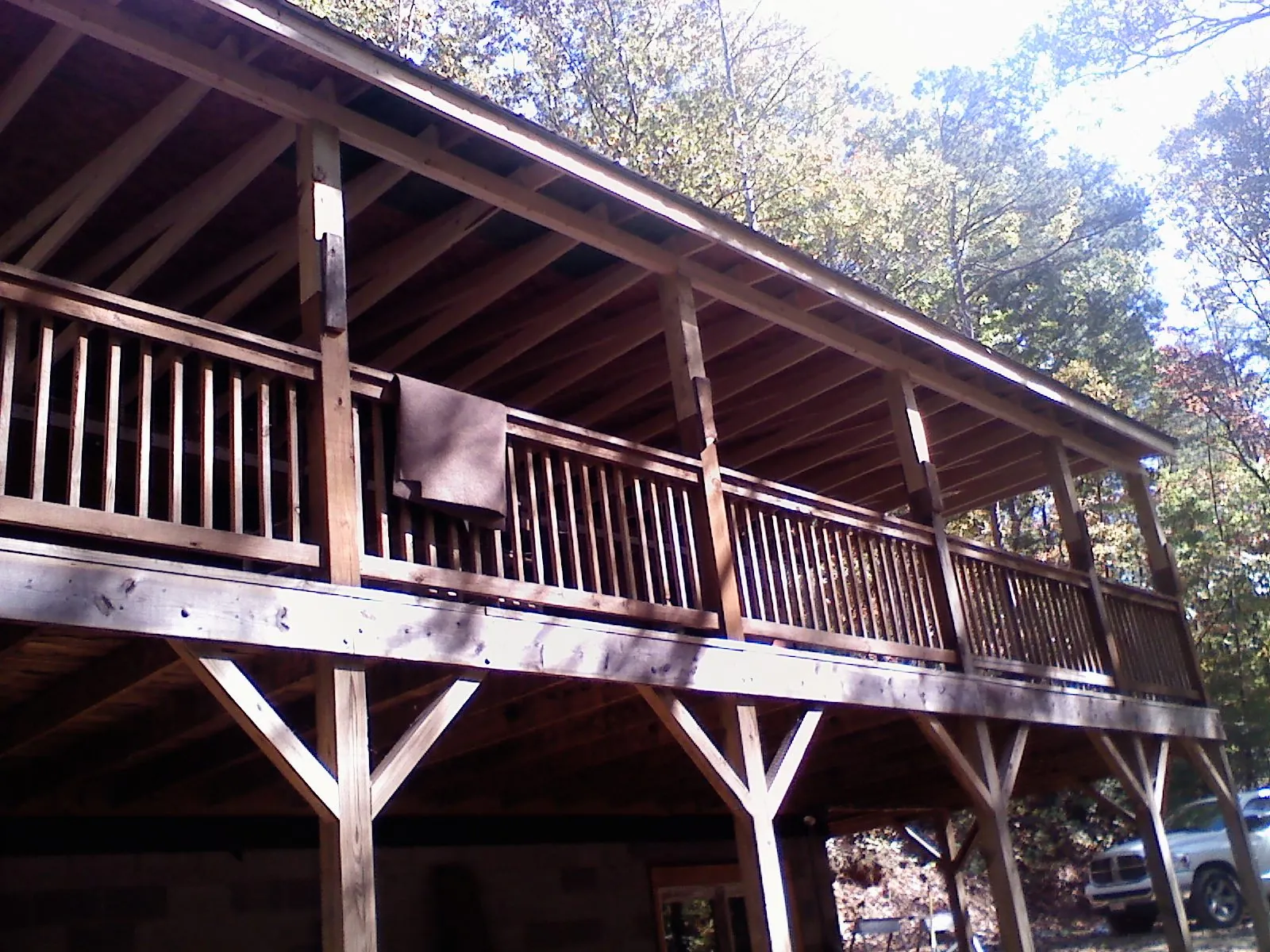 Timber framing under a new elevated porch and deck — Roof Leak Repair in Tecumseh by Roofing Brothers